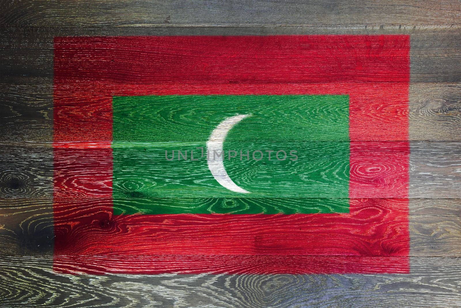 A Maldives flag on rustic old wood surface background