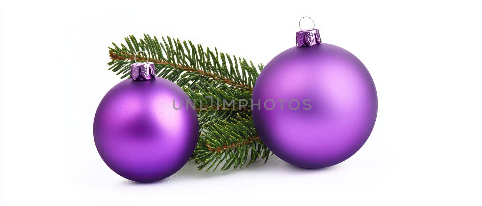 Two purple ornaments sit on a pine branch capturing the essence of Christmas decor and holiday spirit.
