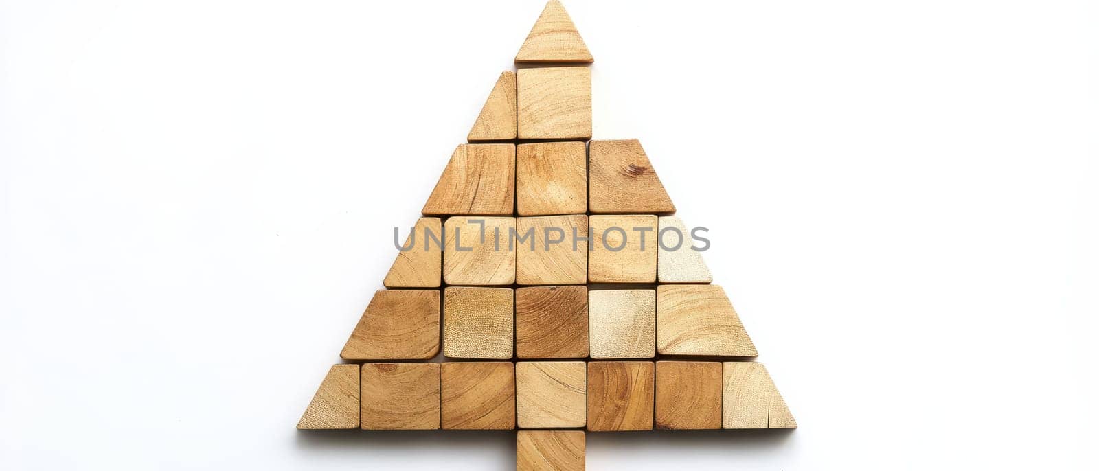 Unique arrangement of wooden blocks forms a simple Christmas tree design on a bright background capturing festive spirit and creativity.