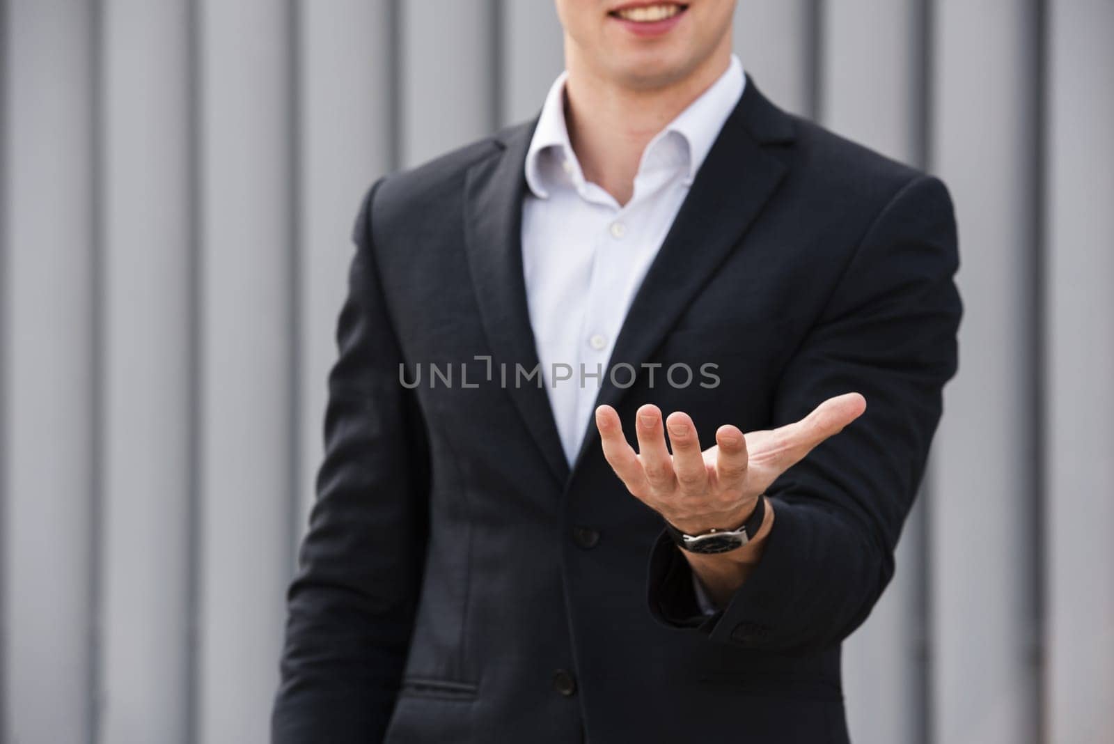front view businessman holding hand out