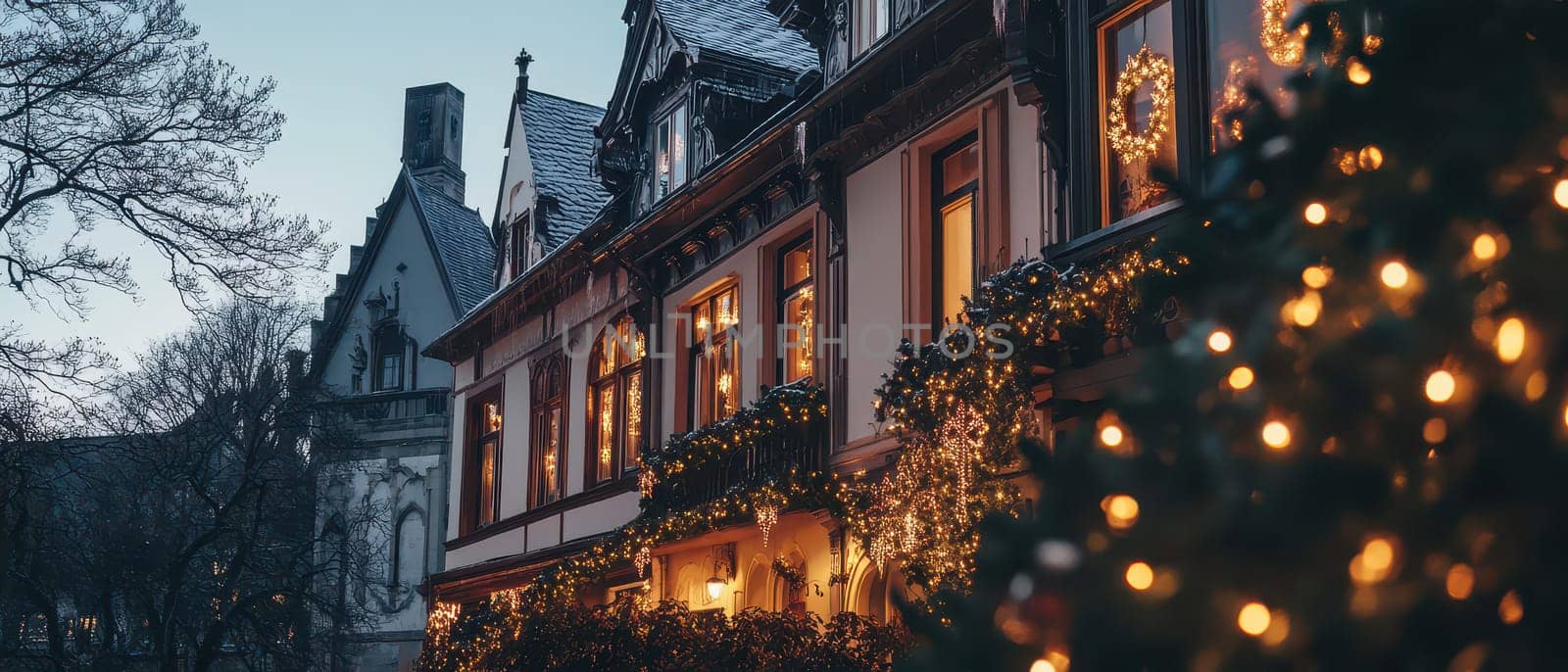 Twinkling lights adorn quaint buildings during a serene winter evening creating a cozy atmosphere filled with holiday spirit.