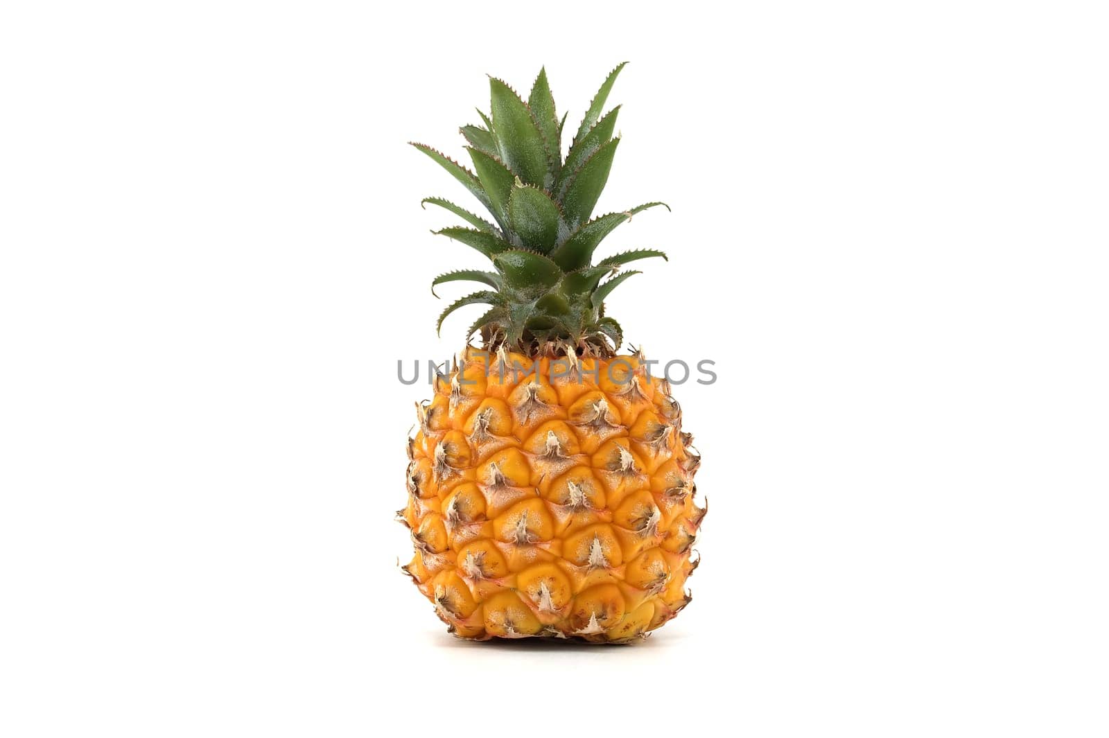 A vibrant, ripe pineapple is showcased against a pure white background, highlighting its texture and color. Ideal for themes of freshness, tropical fruit and healthy eating