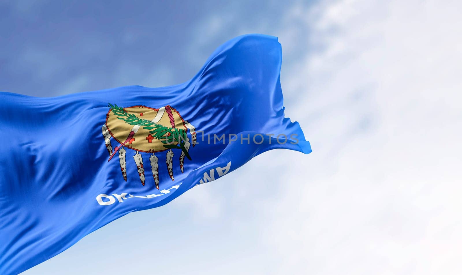 The Oklahoma state flag waving on a clear day. Oklahoma is a state in the South Central region of the United States. 3d illustration render. Rippling fabric