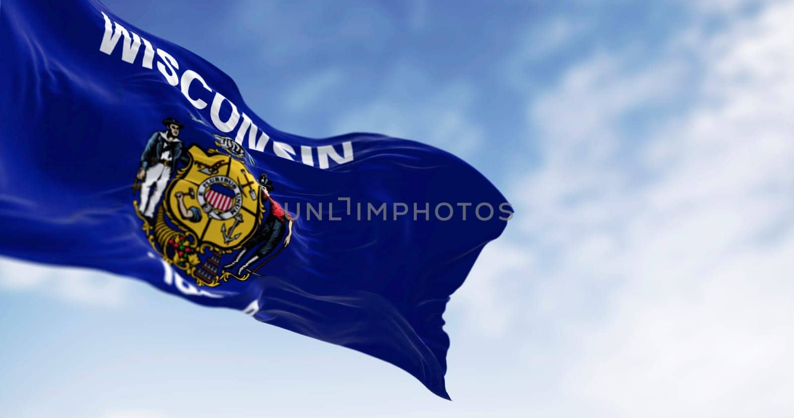 Wisconsin state flag waving in the wind. Blue flag with a central coat of arms. 3d illustration render. Rippled fabric. Textured background. Selective focus