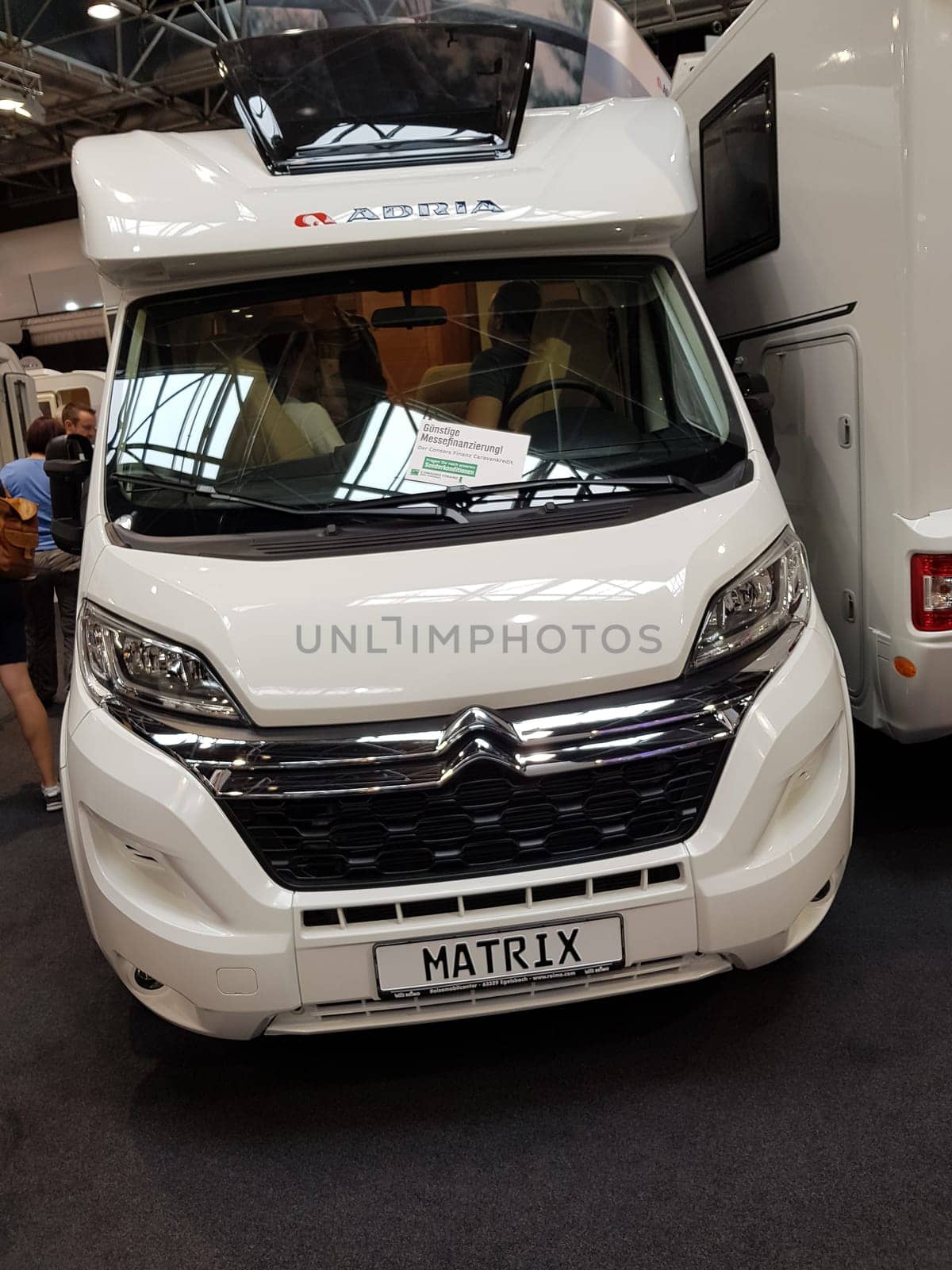 DUESSELDORF, NRW, GERMANY - AUGUST 29, 2018: Duesseldorf, Nrw, Germany - August 29, 2018: Motorhomes and campers for sale or rent at an exhibition. Concept freedom, family vacation trip, holiday trip with camper.