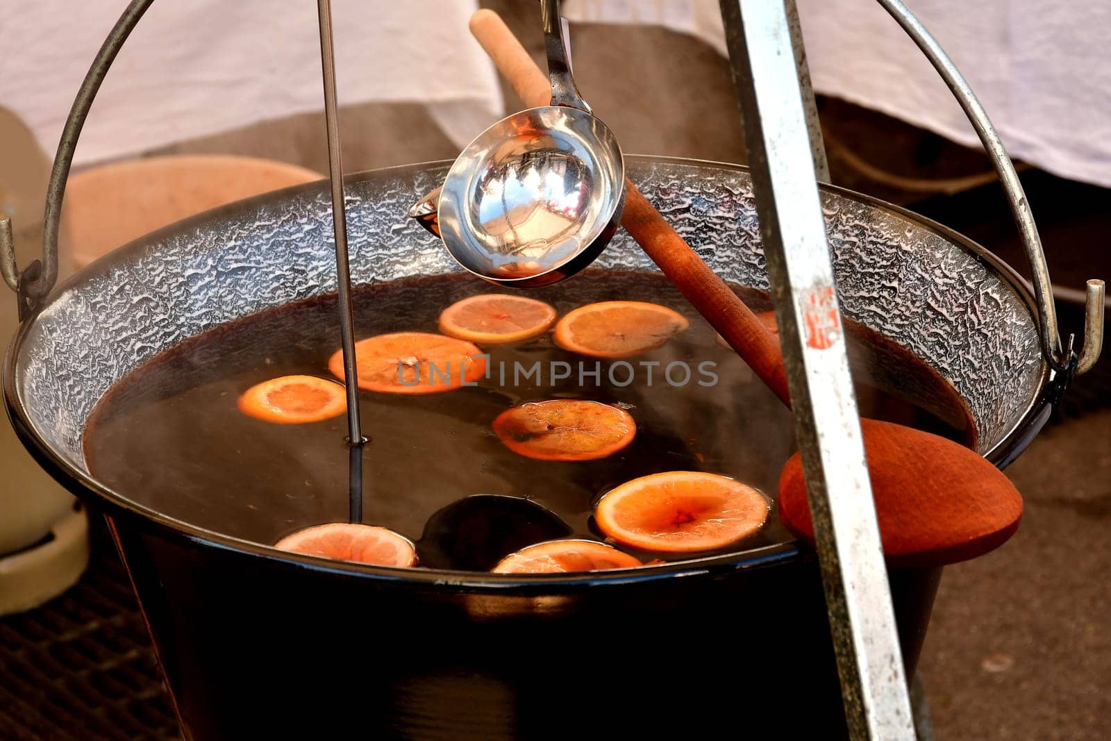 rustic pot with mulled wine on a German Christmas market