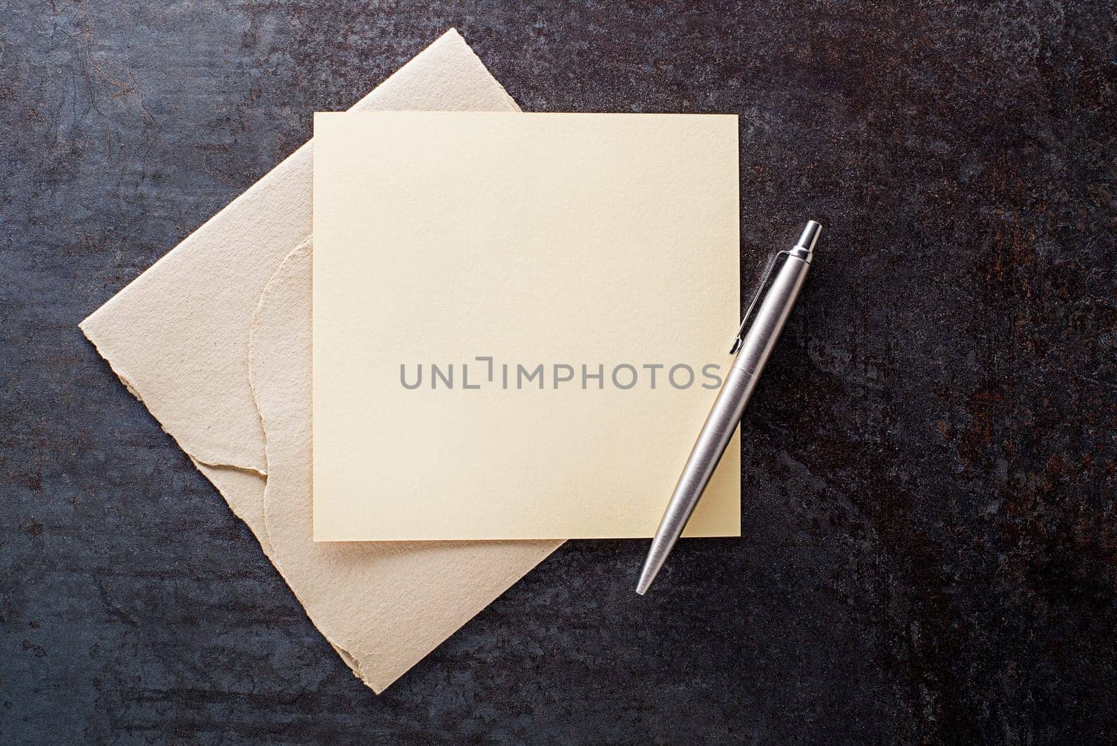 Writing letter on blank paper on grey background