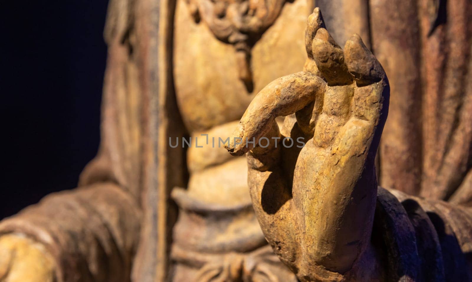 Ancient Buddha hand. Concept of energy, ethnic, harmony, meditation, peace