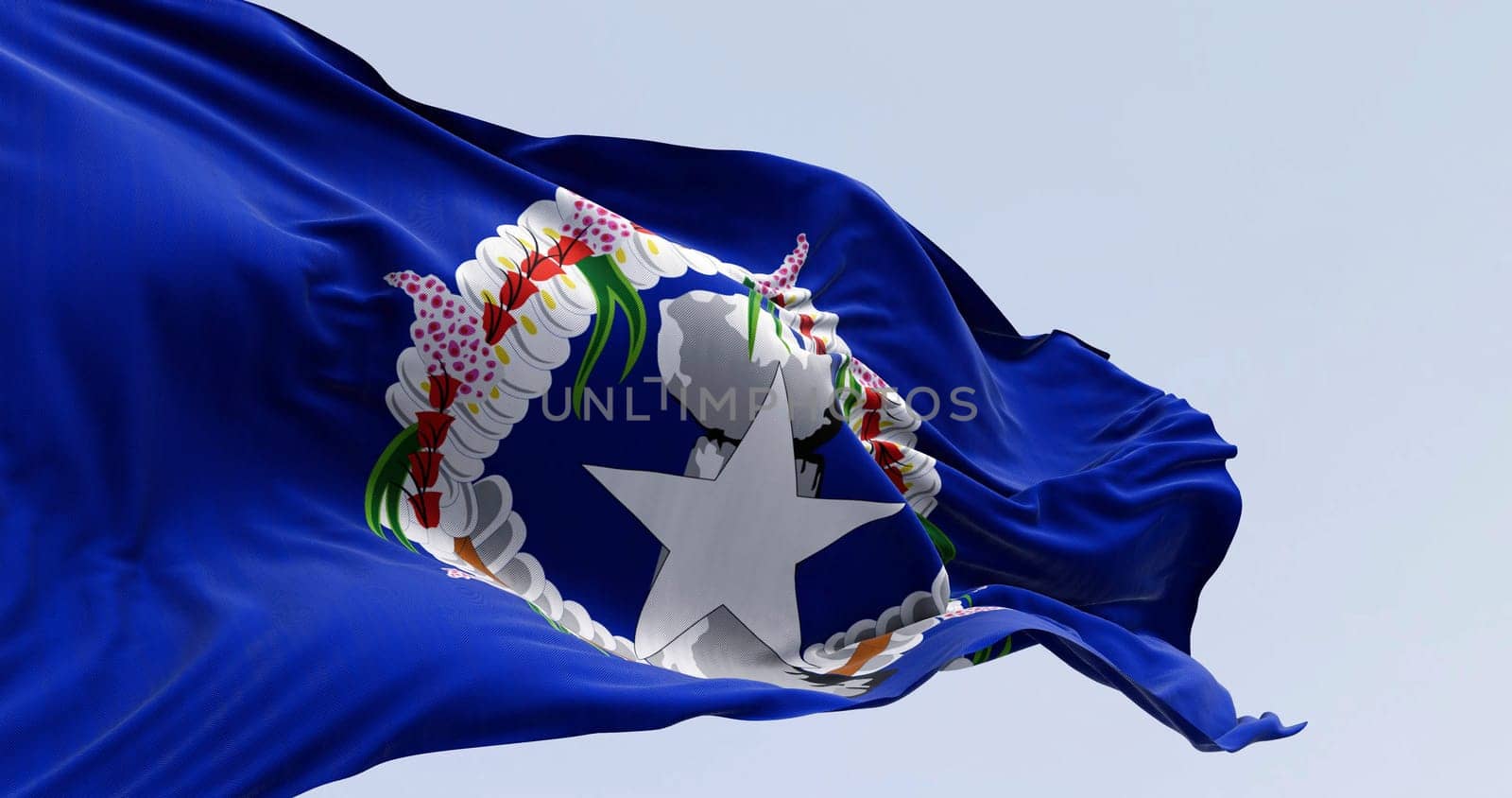 Close-up of Northern Mariana Islands flag waving in the wind on a clear day. Unincorporated territory of the United States. 3d illustration render. Rippling fabric