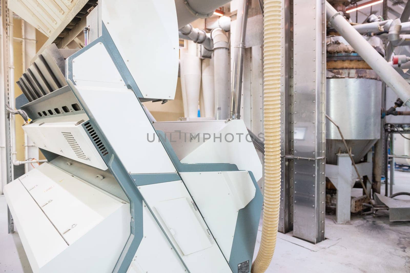 Roller deck machines for husking buckwheat grain, operating in a modern processing facility.