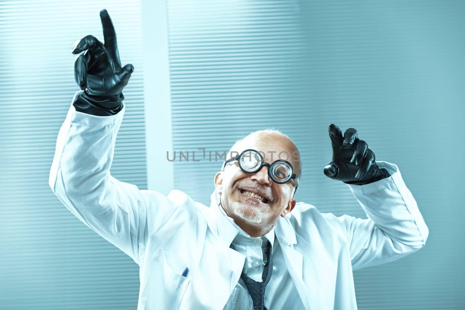 Eccentric senior scientist wearing black gloves and round glasses raises his arms in a celebratory gesture, expressing joy and excitement within a laboratory setting
