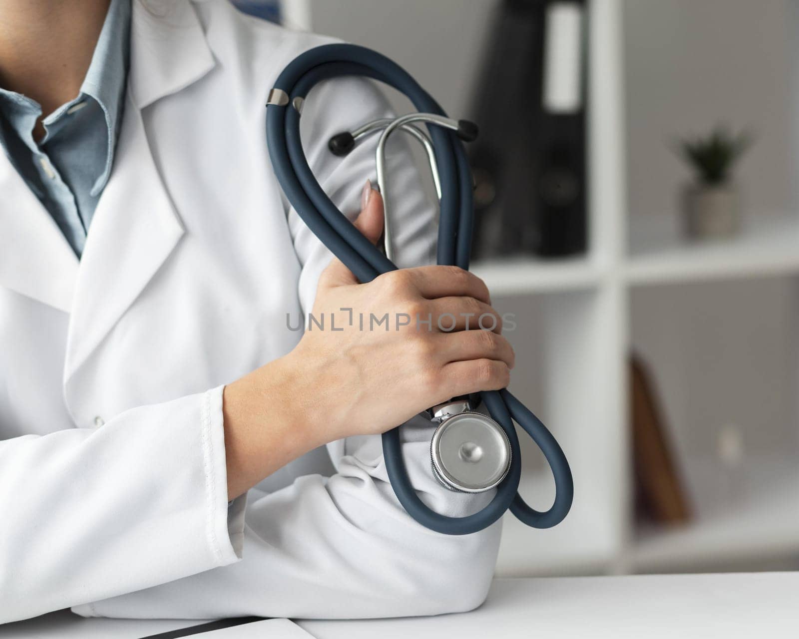 close up doctor holding stethoscope