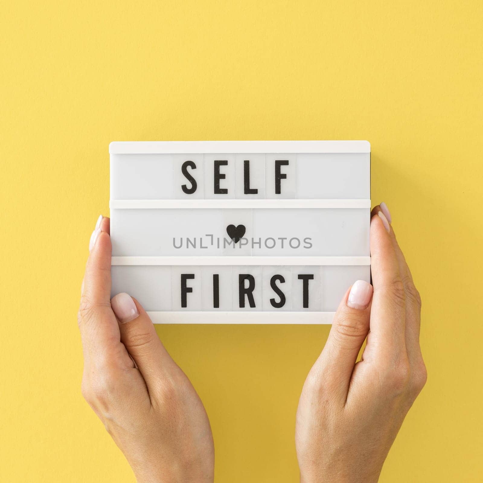 close up hands holding message board