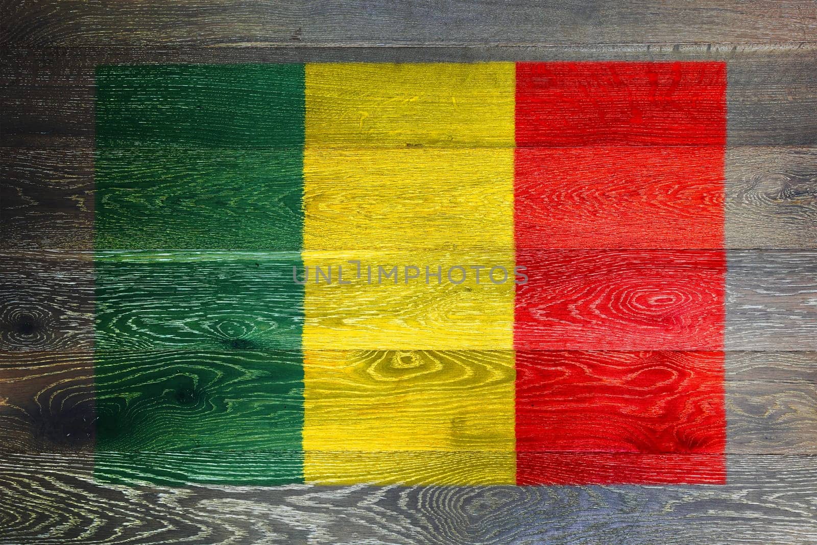 A Mali flag on rustic old wood surface background