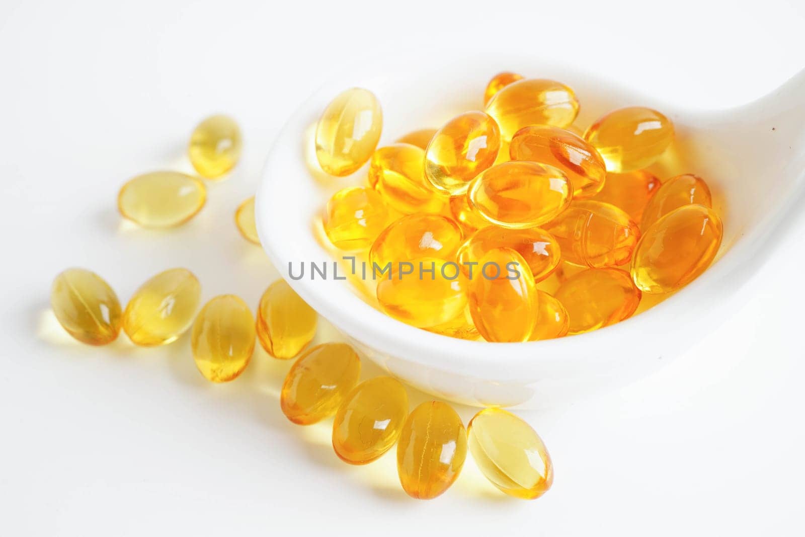 Fish oil or Cod liver oil gel in capsules with omega 3 vitamins, supplementary healthy food.