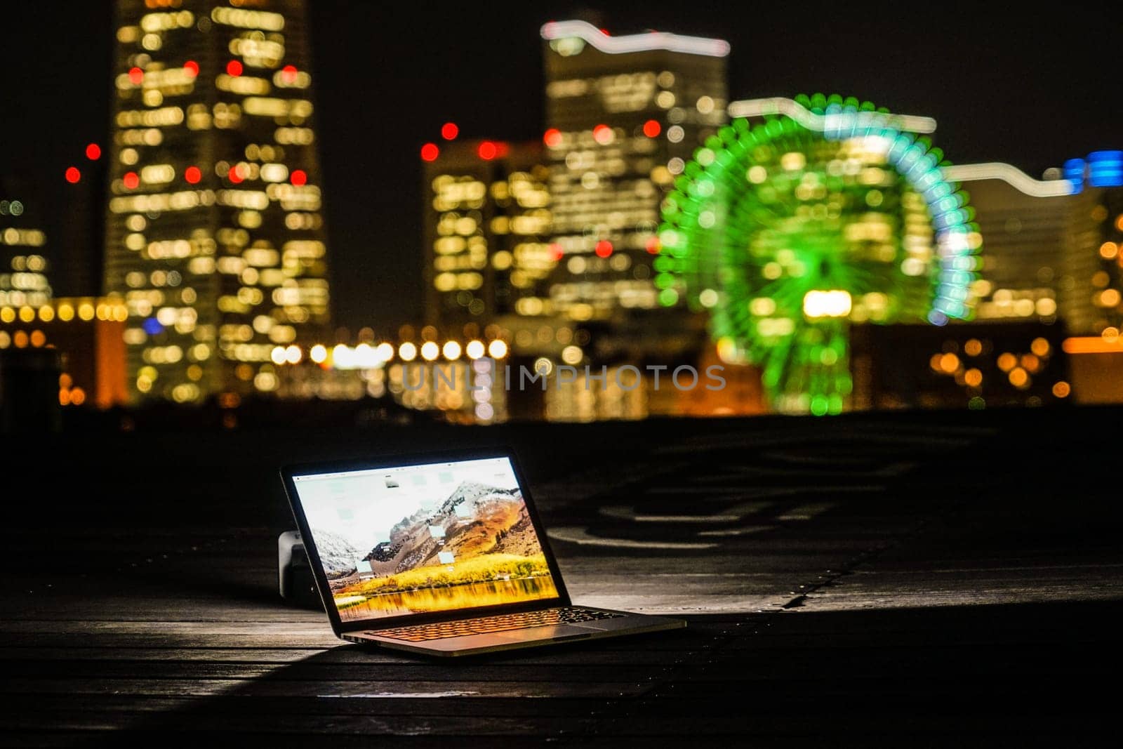 Yokohama night view and a laptop (Nomad worker of the image). Shooting Location: Yokohama-city kanagawa prefecture