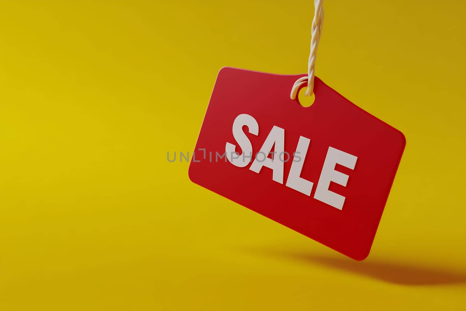 A vibrant red sale tag hangs against a cheerful yellow background, promoting discounts and special offers for shoppers.