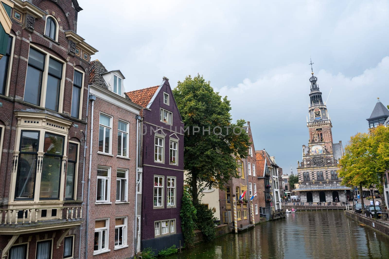 Alkmaar, Netherlands, - View of the city and the weighing house, with the water canal in the foreground