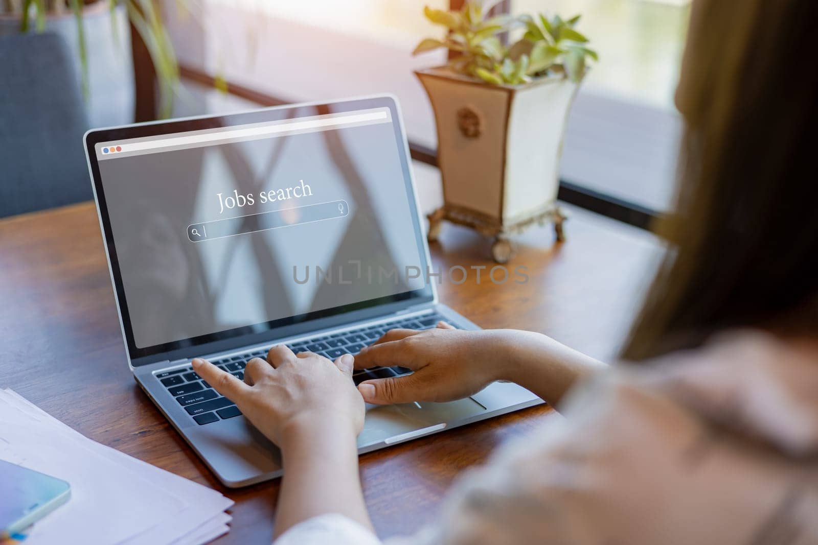 Woman looking at online website by laptop computer, Job search concept, Find your career, People searching for vacancies or position on the internet, Finding jobs, Unemployed and poor economy.