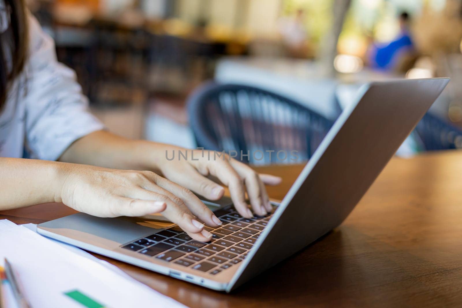 Business woman working from home using laptop online meeting in home office, Closeup image of a woman working and typing on laptop computer keyboard on the table.