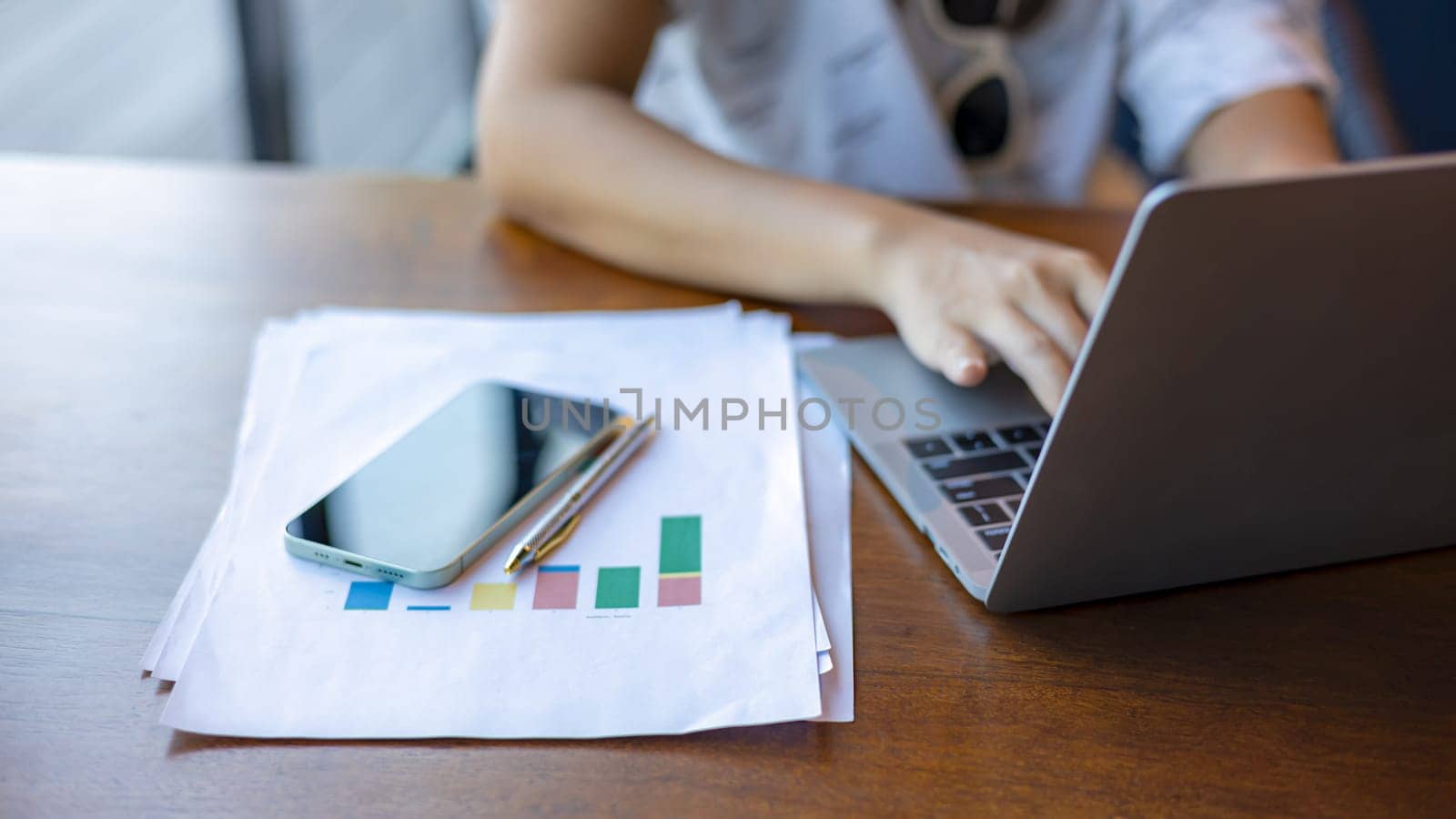 Business woman working from home using laptop online meeting in home office, Closeup image of a woman working and typing on laptop computer keyboard on the table.