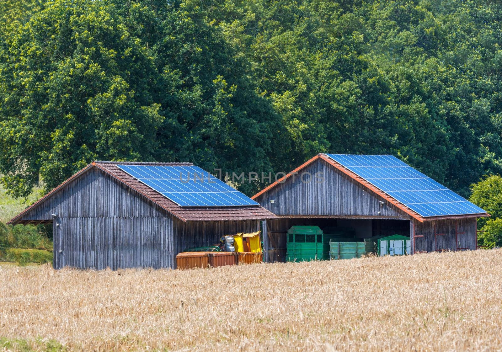 Green energy with solar collectors on the roof of agricultural buildings