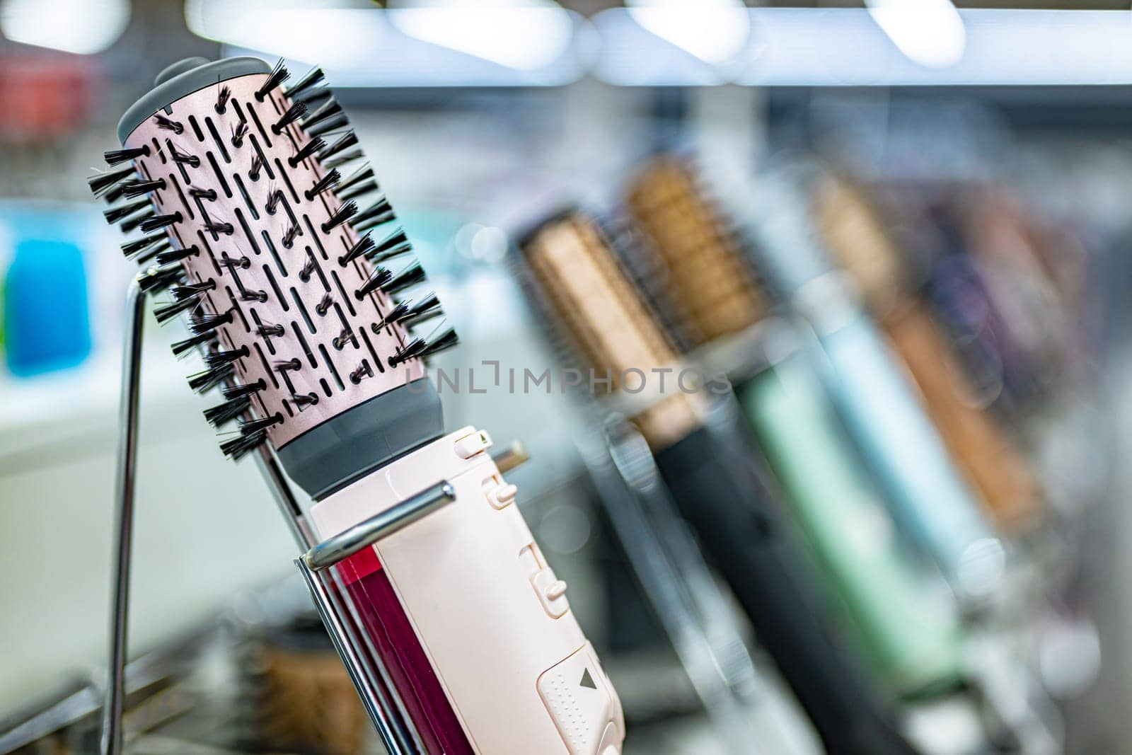 Hair dryers put up for sale in a home appliance store.