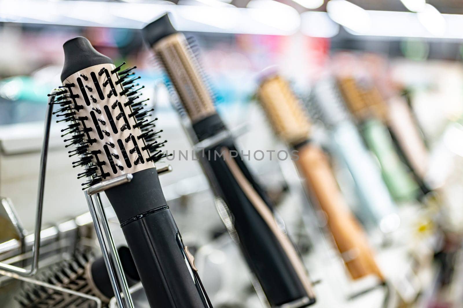 Hair dryers put up for sale in a home appliance store.