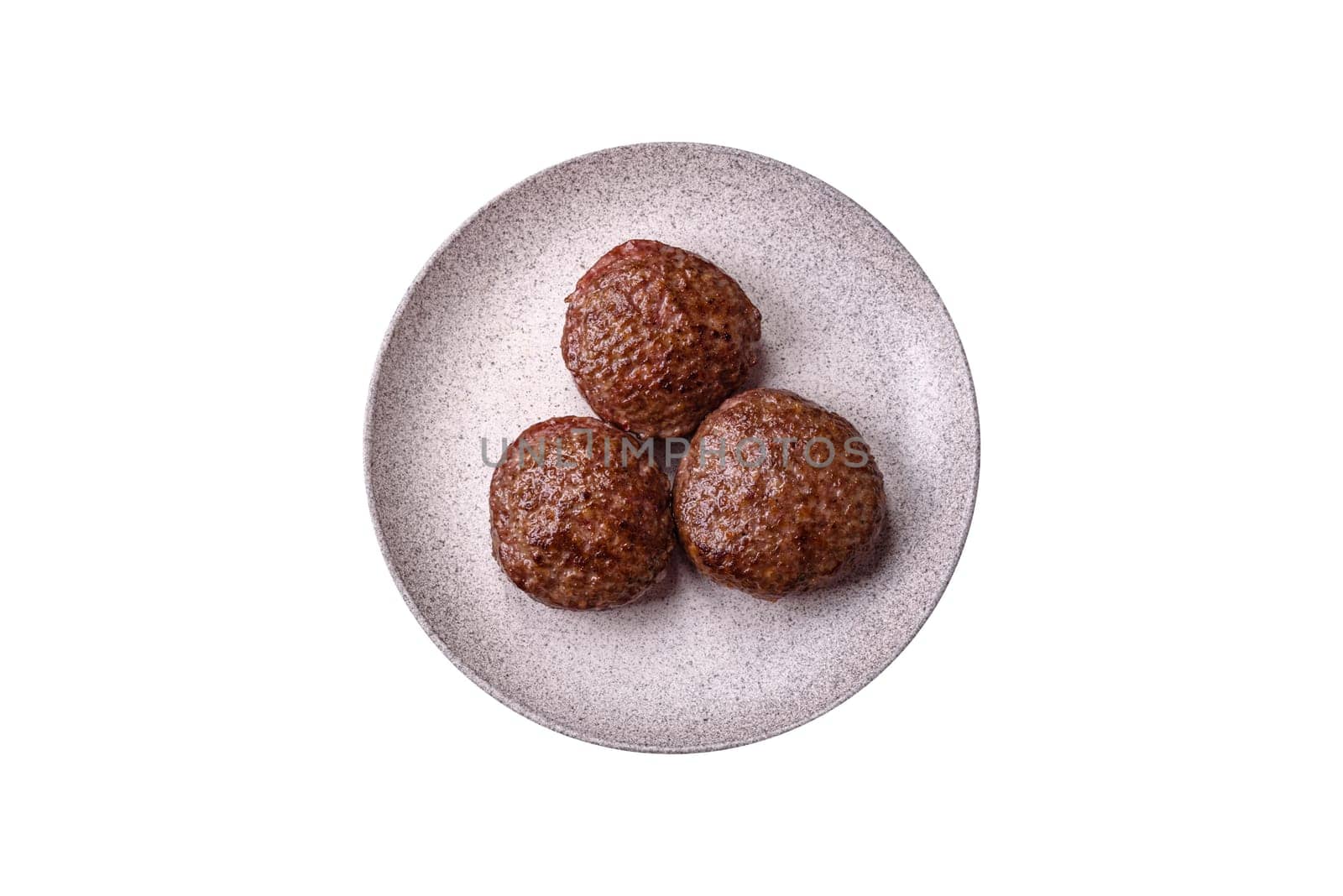 Beef burger patties with salt, spices and herbs grilled on a white background