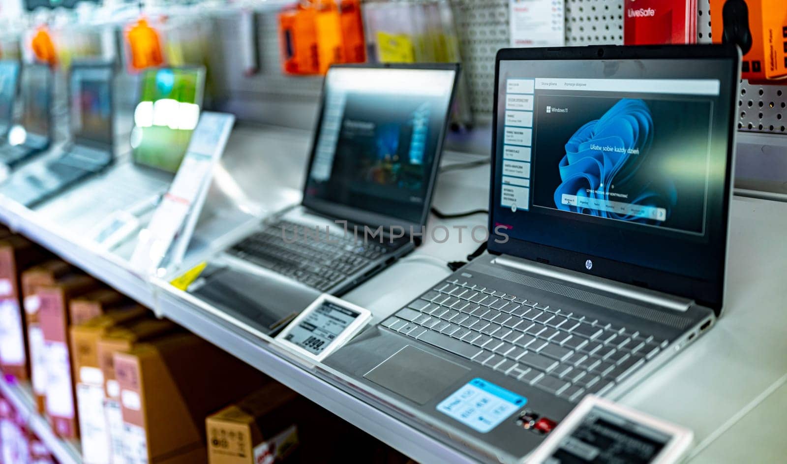 POZNAN, POL - DEC 5, 2024: Laptop computers put up for sale in a store.