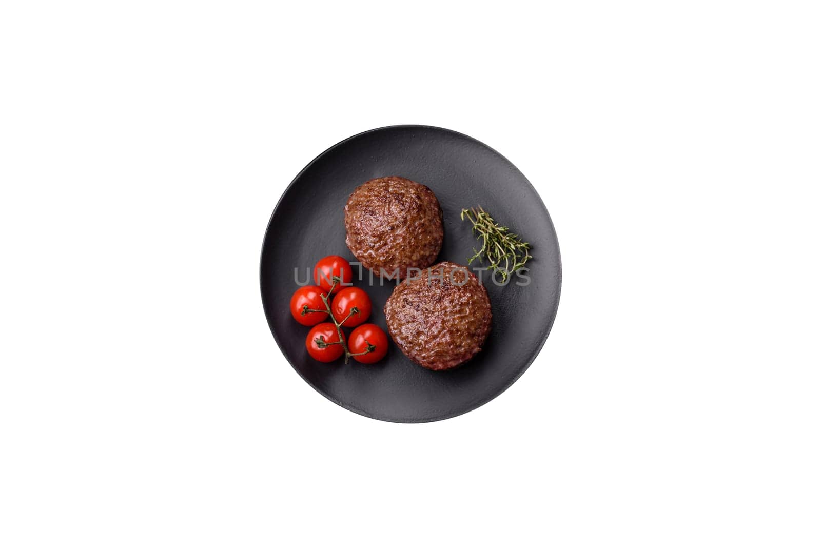 Beef burger patties with salt, spices and herbs grilled on a white background