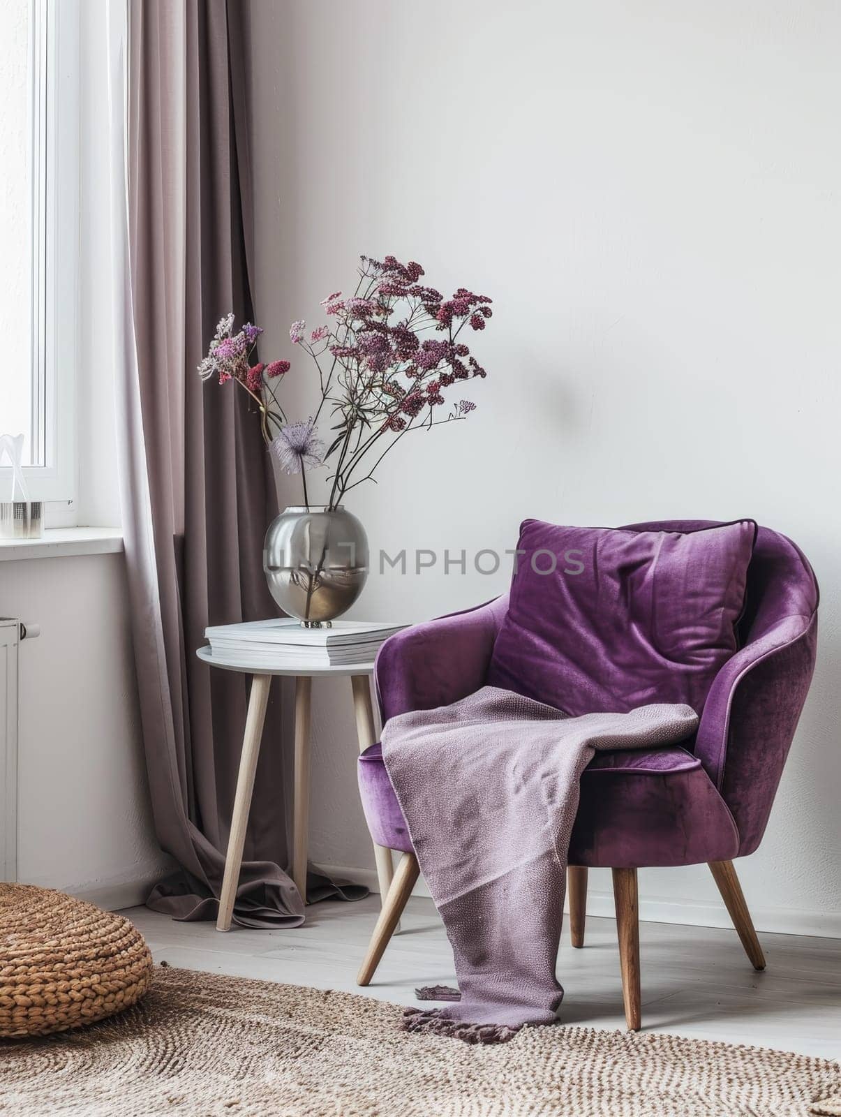 A comfortable purple armchair set in a modern interior with soft lighting and decor