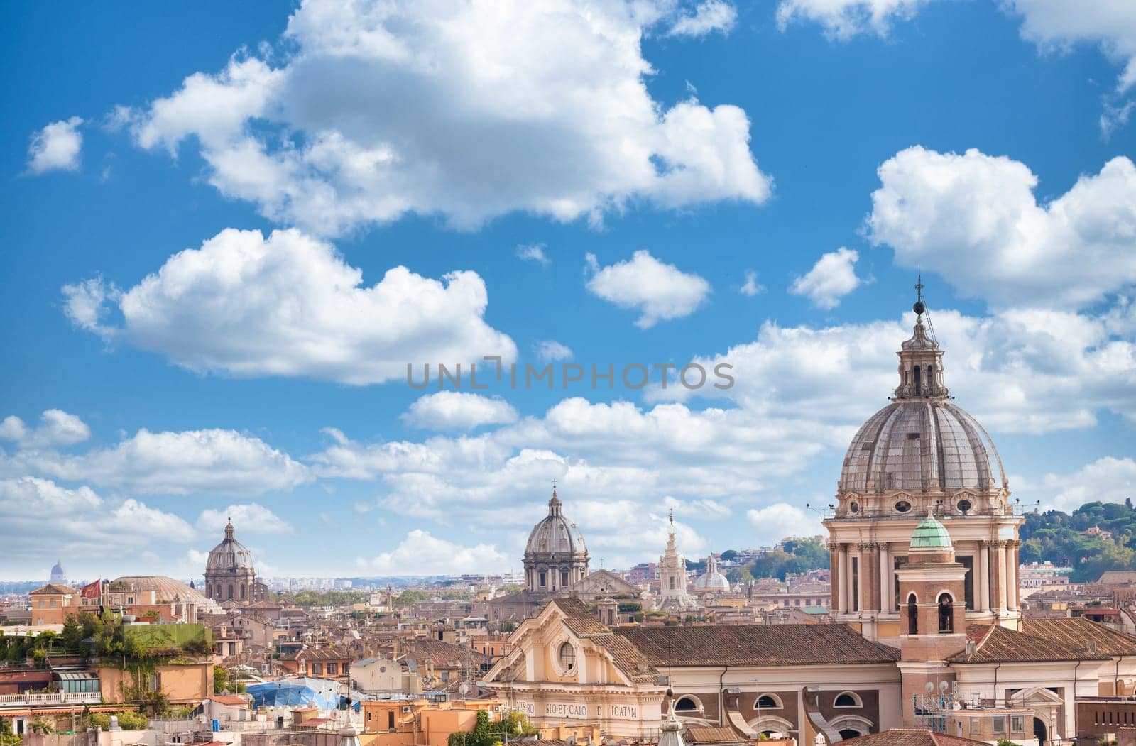 Rome, Italy. Urban landscape, blue sky with clouds, church exterior architecture.