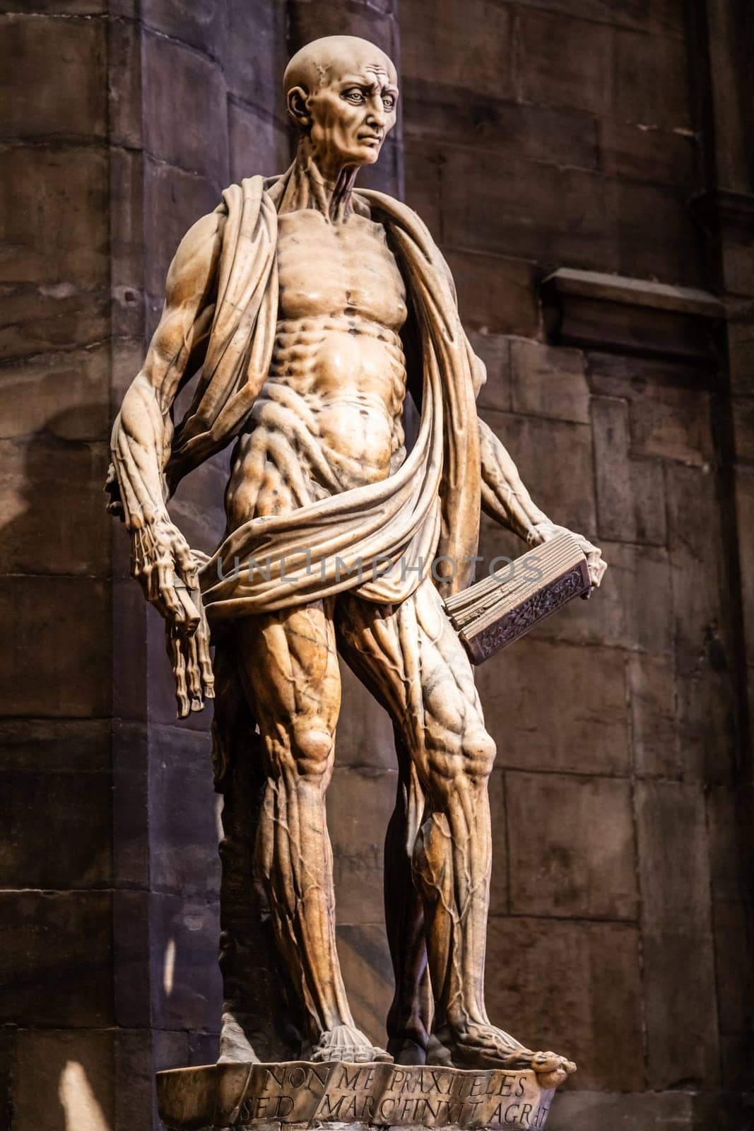 MILAN, ITALY - JULY 28, 2024: statue of Saint Bartholomew flayed - San Bartolomeo Scorticato - in Milan Cathedral, second half of 16th century.