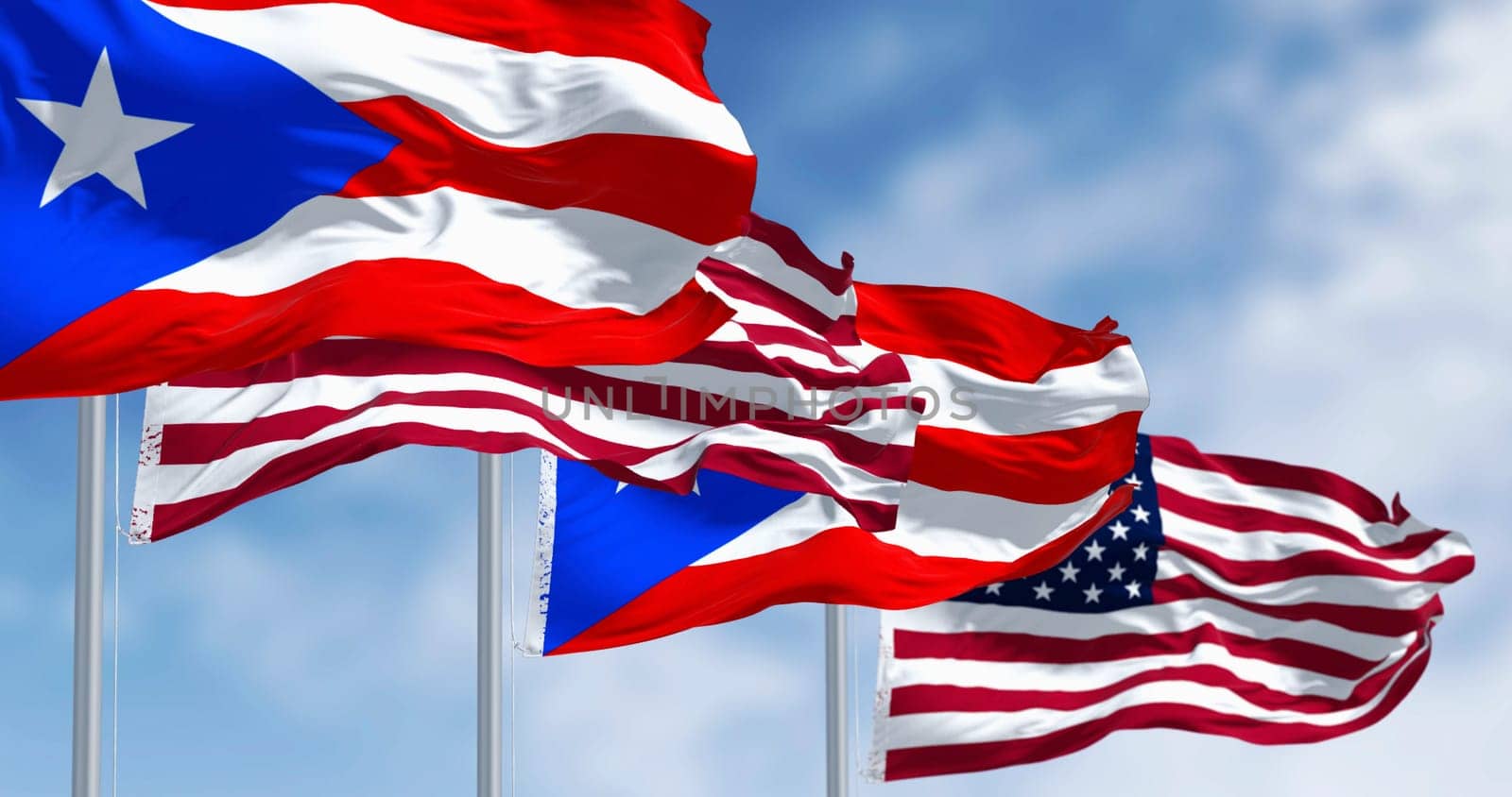 Flags of Puerto Rico waving with the United States flags on a clear day. Puerto Rico is a Caribbean island and unincorporated territory of the United States. 3D illustration render. Rippling fabric