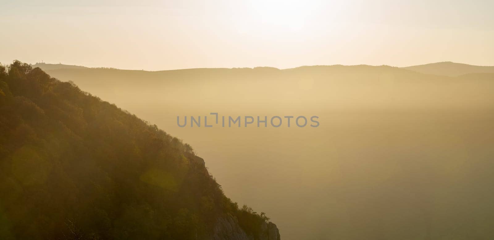 Sunset in the mountains of Crimea, Sunset landscape with rays of sun and mountains.