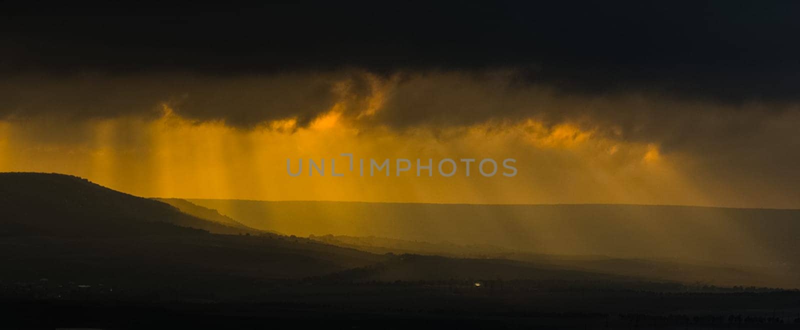 Sunset in the mountains of Crimea, Sunset landscape with rays of sun and mountains.