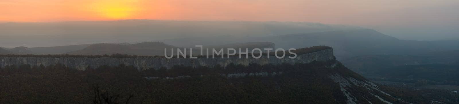 Sunset in the mountains of Crimea, Sunset landscape with rays of sun and mountains.