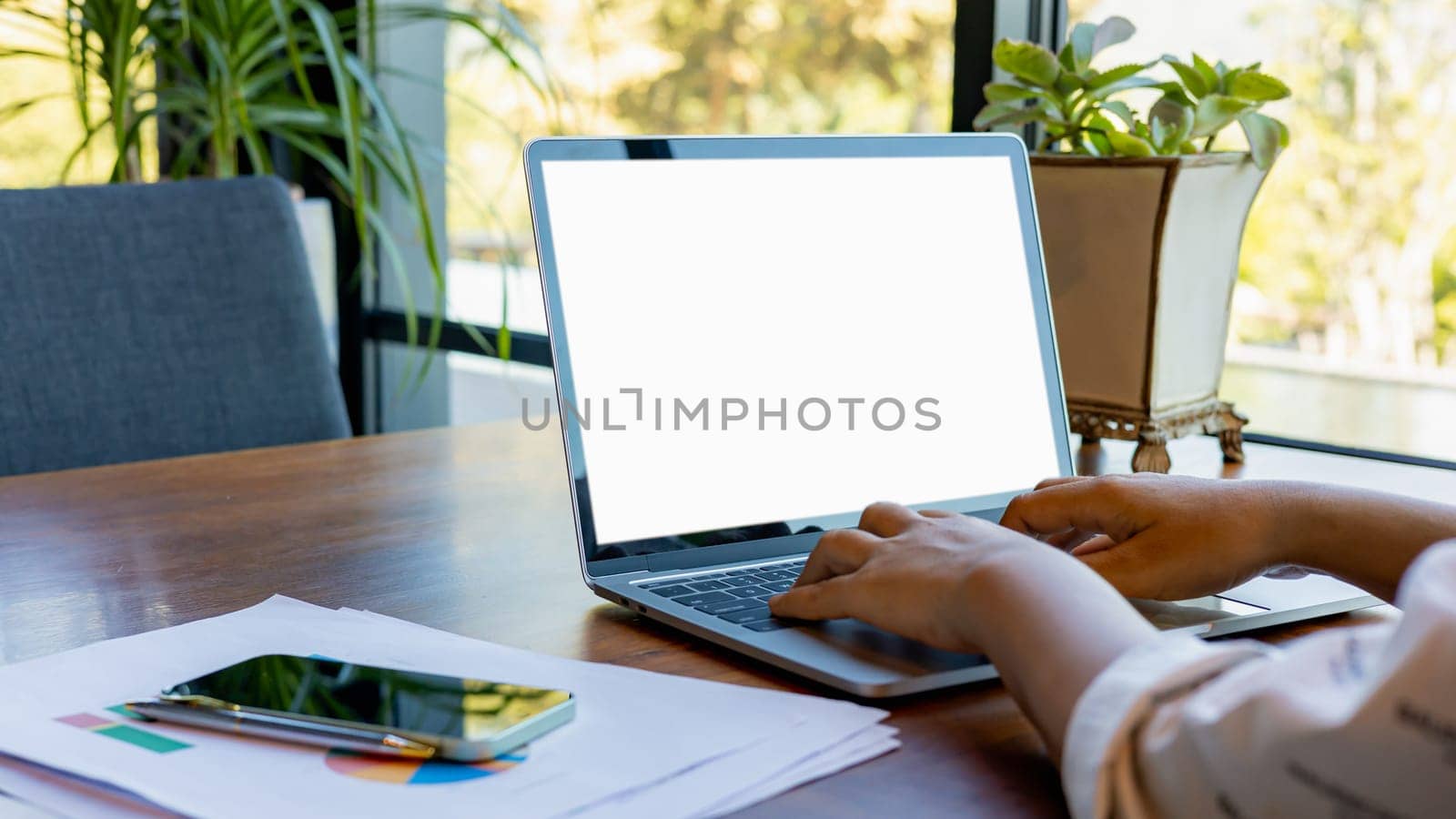 Woman hand use laptop and looking at it, Blank screen tablet with white background for advertising text, Human using laptop contact business search information, Marketing and creative design.
