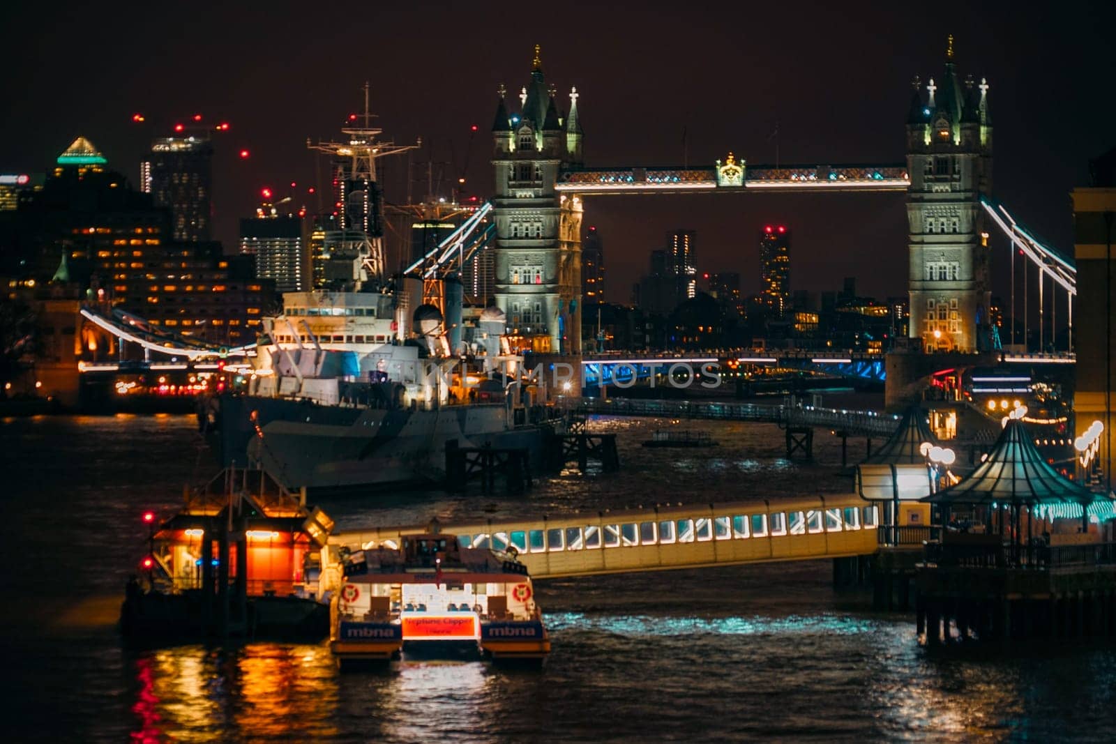 Night view of Tower Bridge and ships in London. Shooting Location: UK, London