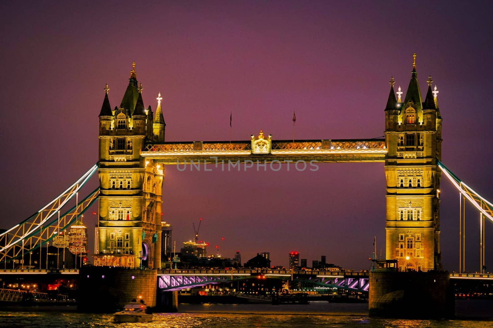 Illuminated tower bridge at dusk. Shooting Location: UK, London