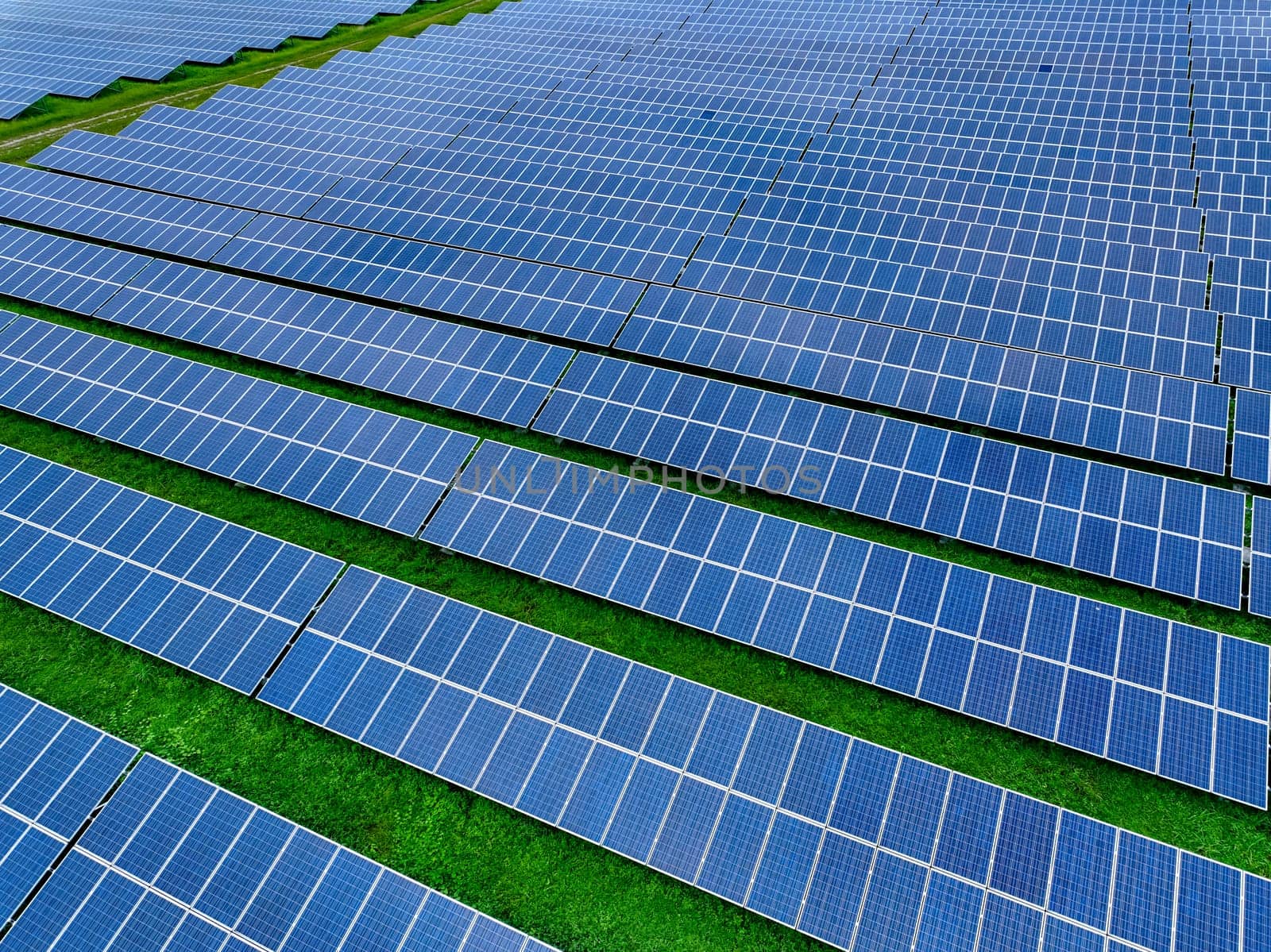 Aerial view of solar farm. Sustainable renewable energy and modern photovoltaic technology for eco-friendly electricity production. Solar power station. Green energy solutions. Solar panel technology.