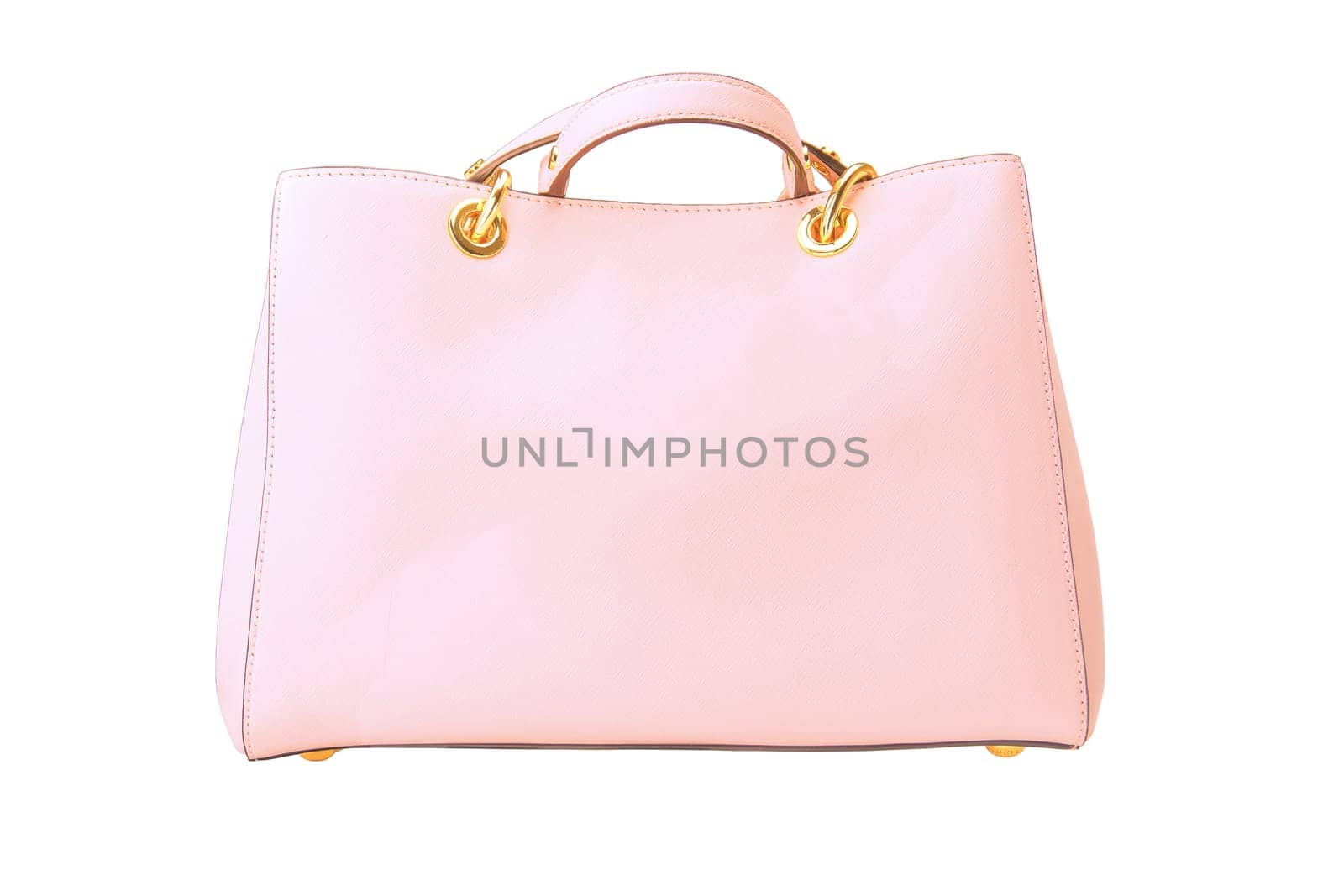 Stylish women's handbag. A fashionable female pink luxury handbag isolated on white. Fashionable womans accessories. Clipping path. Advertising.