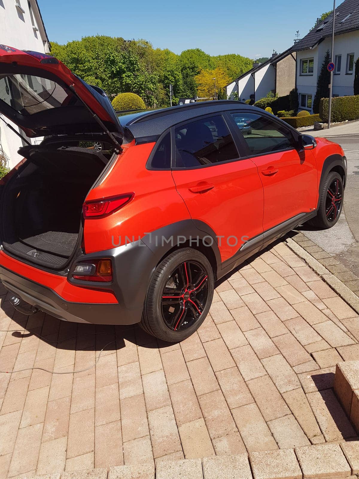 VELBERT, NRW, GERMANY - MAY 05, 2020: Velbert, Nrw, Germany - May 05, 2020: Hyundai Kona small SUV car, with new aluminum rims with red stripes
