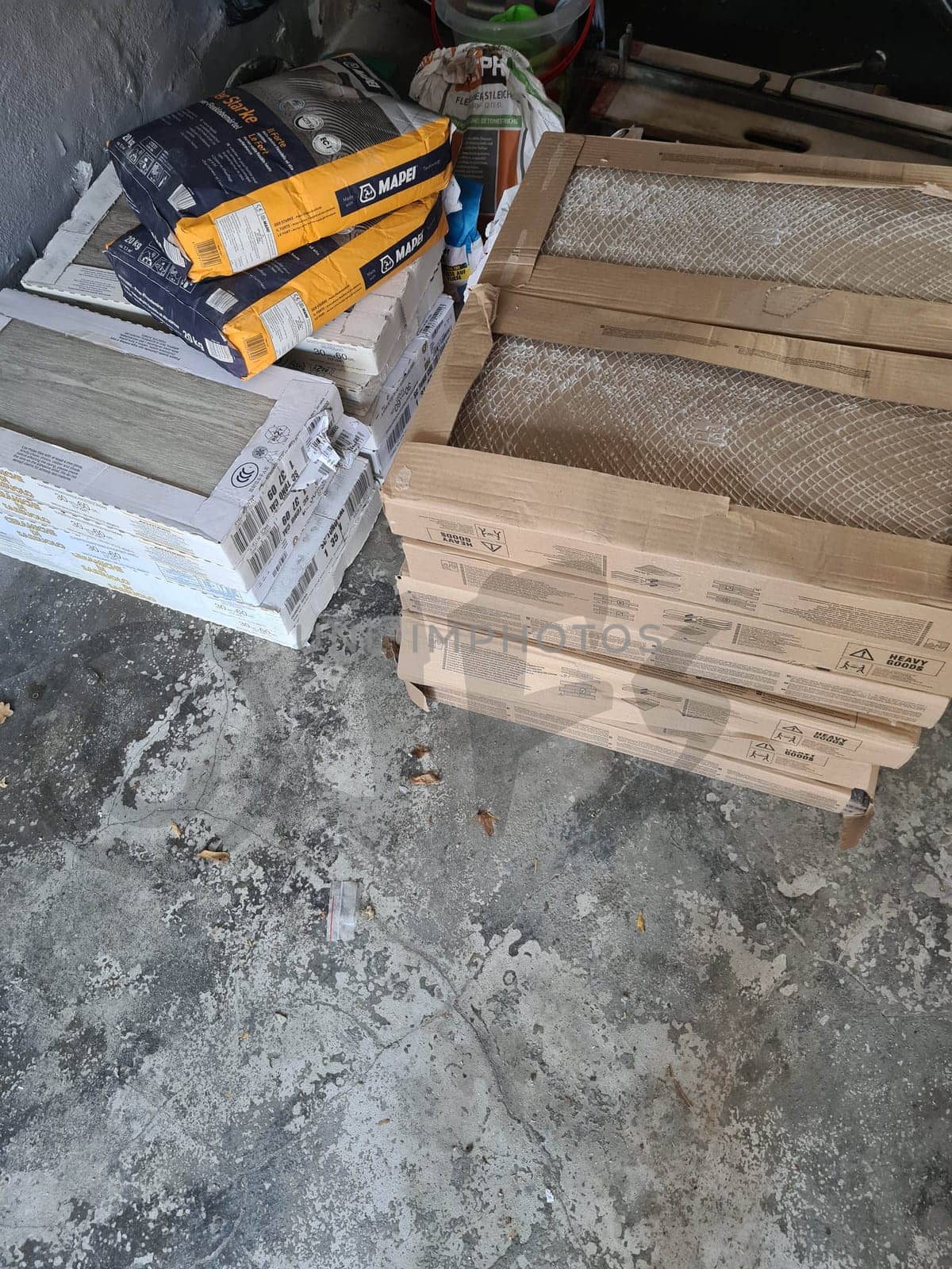 HEILIGENHAUS, NRW, GERMANY - NOVEMBER 06, 2020: Heiligenhaus, Nrw, Germany - November 06, 2020: Tiles, bricks, tools and building materials for house building