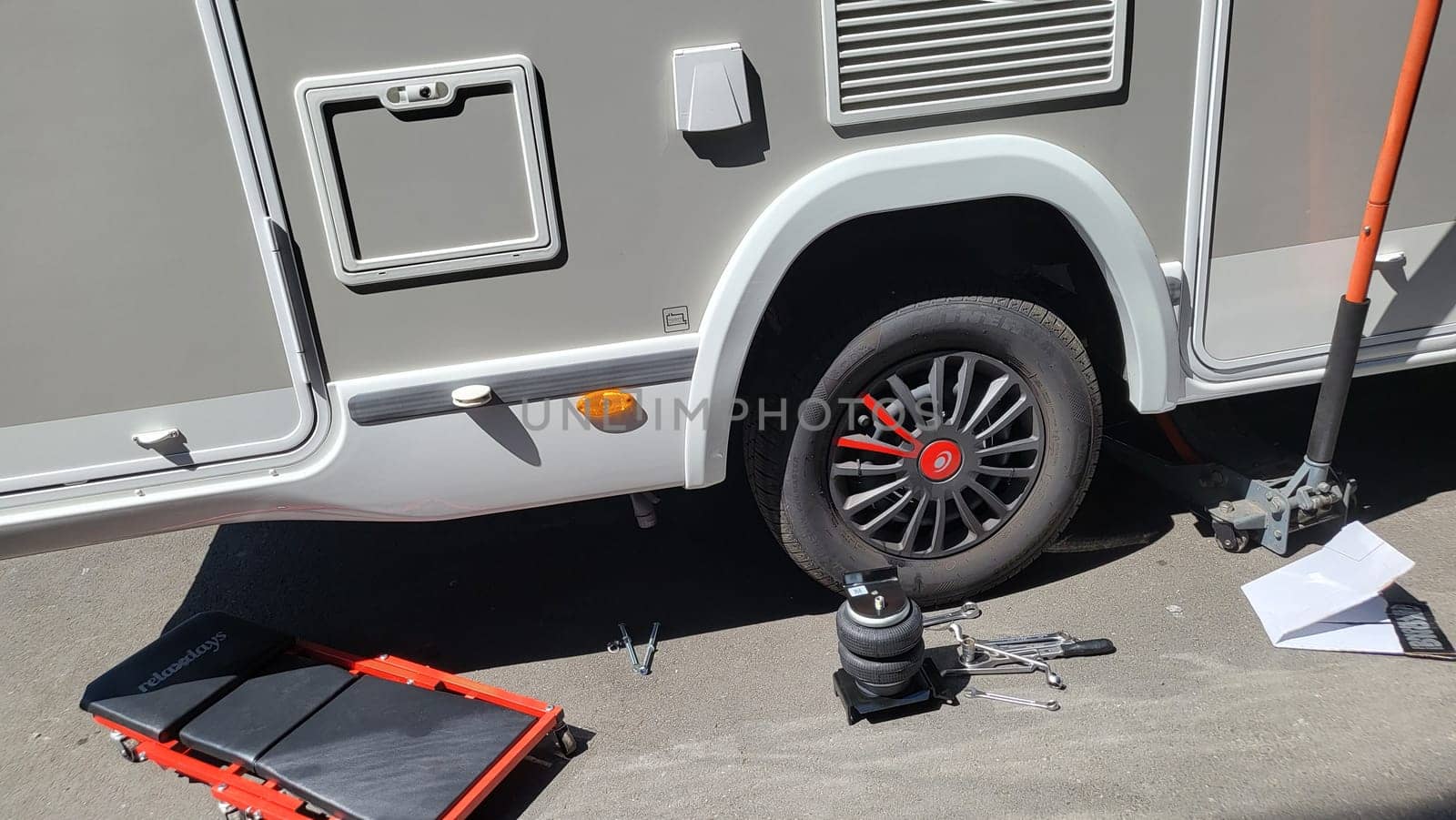 VELBERT, NRW, GERMANY - June 16, 2022: Velbert - June 16, 2022: Installation of an additional air suspension in a mobile home to increase the load capacity