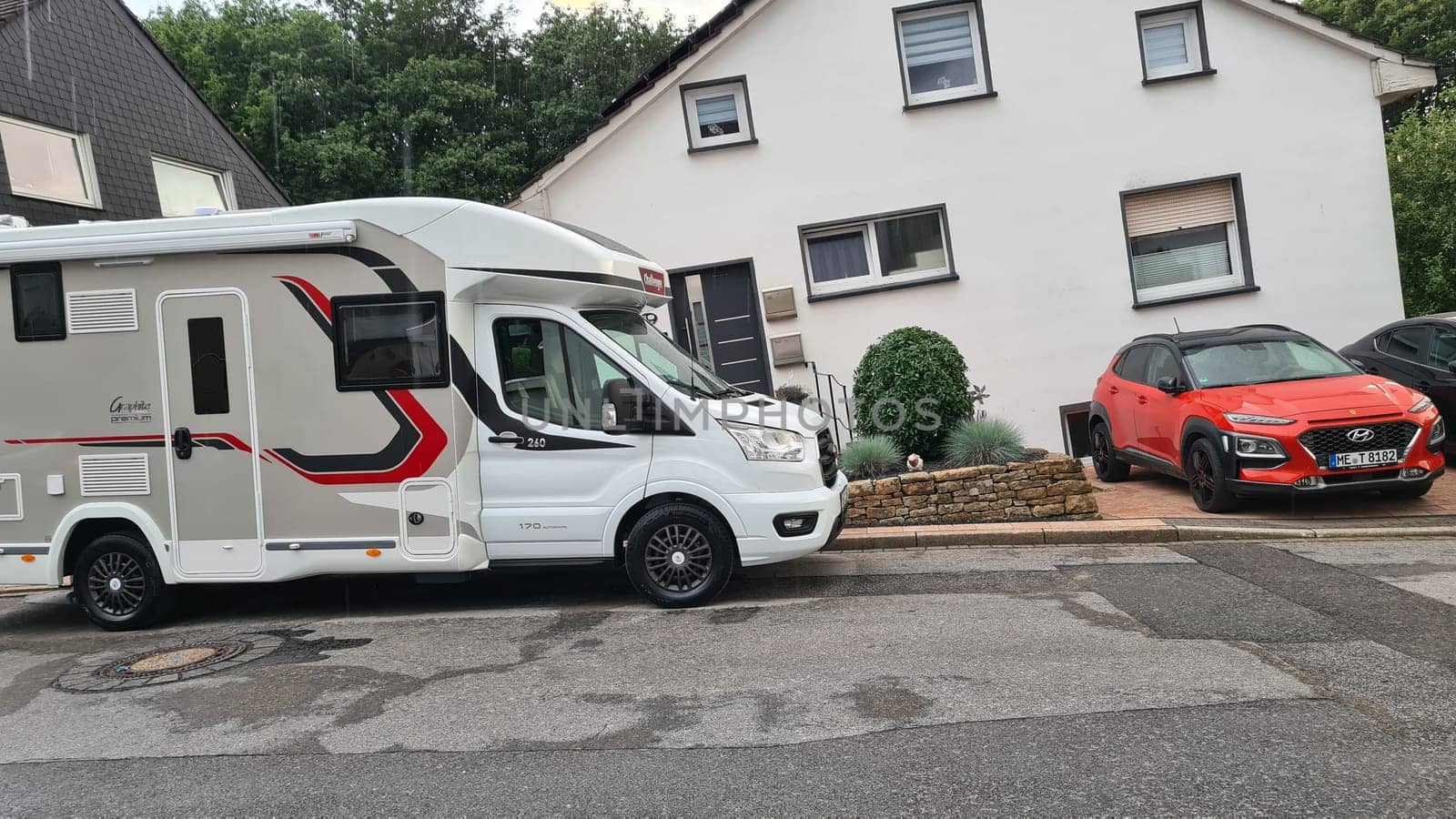 HEILIGENHAUS, NRW, GERMANY - JULY 31, 2021: Heiligenhaus, Nrw, Germany - July 31, 2021: Motorhomes and campers for sale or rent. Concept freedom, family holiday travel, vacation travel with camper.