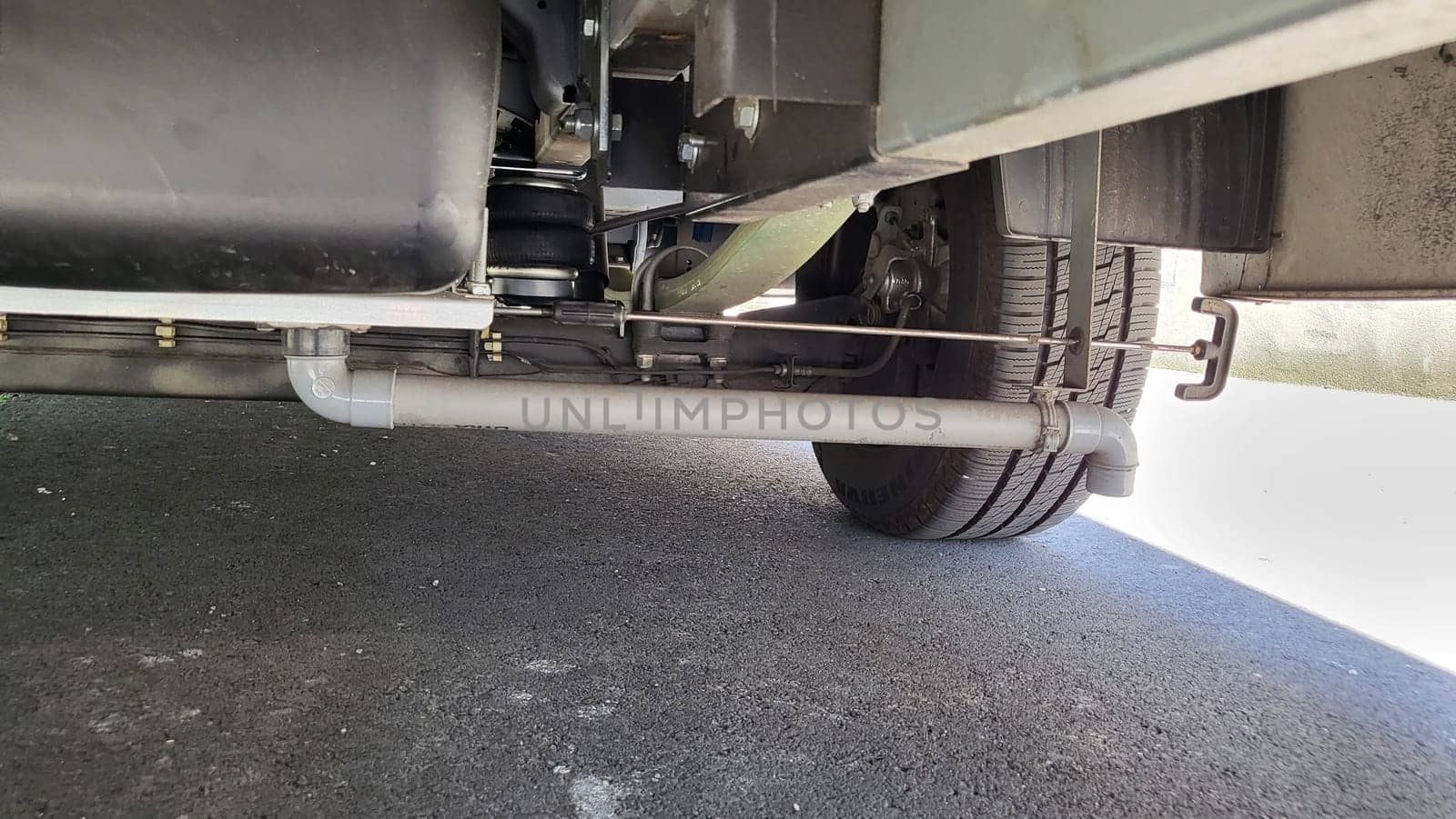 VELBERT, NRW, GERMANY - June 16, 2022: Installation of an additional air suspension in a mobile home to increase the load capacity