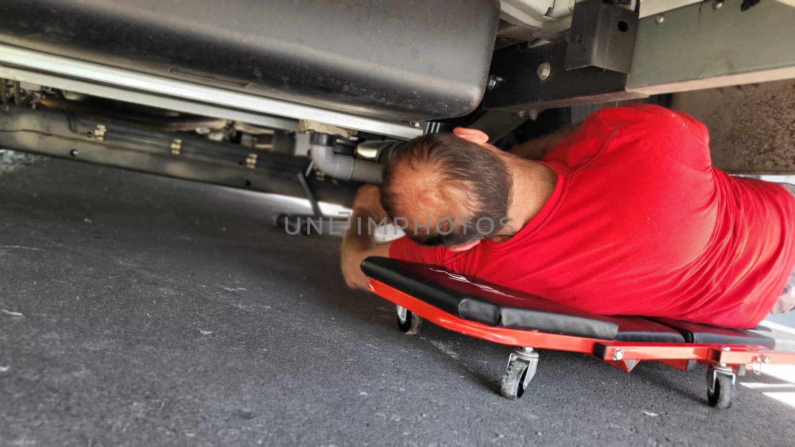 VELBERT, NRW, GERMANY - June 16, 2022: Installation of an additional air suspension in a mobile home to increase the load capacity