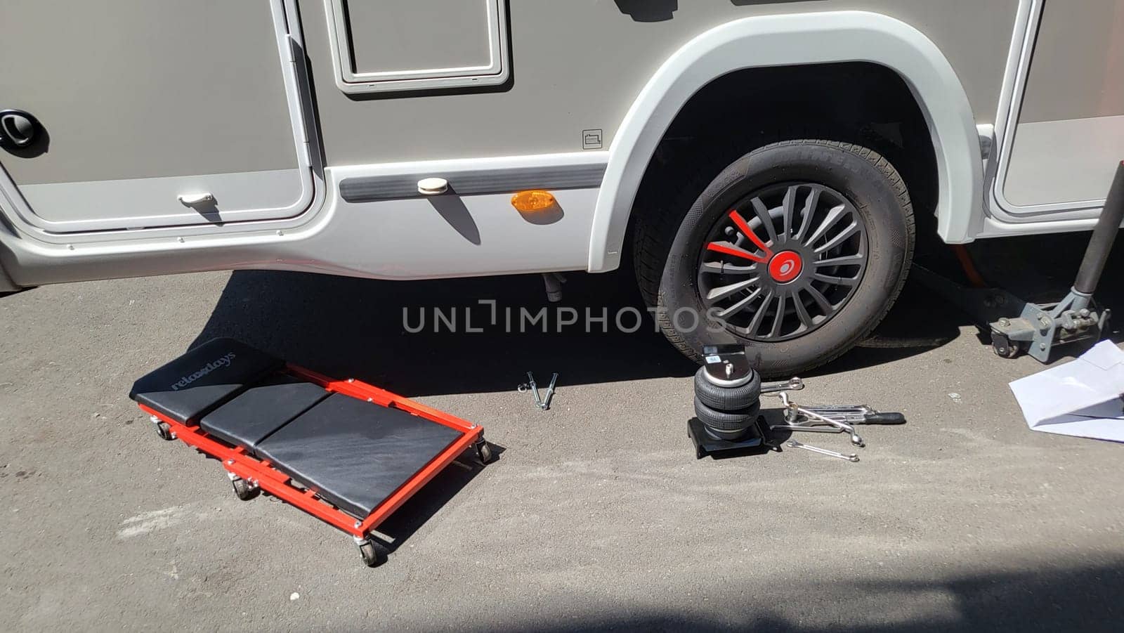 VELBERT, NRW, GERMANY - June 16, 2022: Installation of an additional air suspension in a mobile home to increase the load capacity